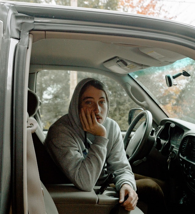 sad man in car